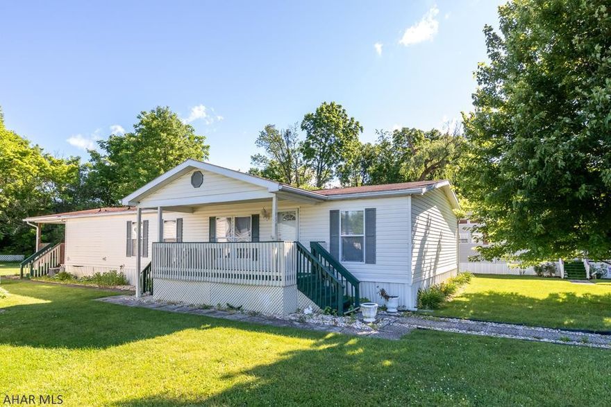 Enjoy this  55+ development tucked away behind Wendy's plaza right after Ollie's which allow little traffic (local only) allowing you to enjoy peace and quiet.  This 2001 double wide has 3 bedrooms one of which is the Master Bedroom and Master Bath, living room is spacious, right off dining area.  Kitchen is modern with an island with open view to family room.  Enjoy the morning sun or afternoon sun on the covered porch or covered deck.  See pictures.  Come see for yourself.