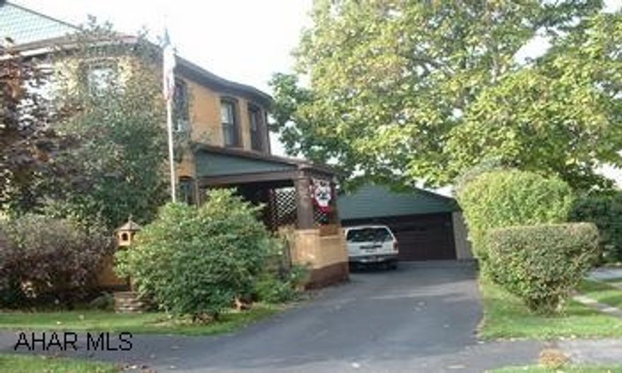 Excellent condition new roof, windows, and electric. Unique meticulous home.  Original woodwork.  Large rooms.  Extra bonus room on 1st floor for familyroom.  Usable basement.  2 car block garage.  Pellet stove is negotiable.