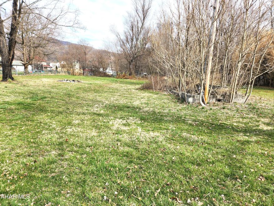 Are you looking for a nice level lot to build a home?  You'll want to take a look at this property.  This open lot is ready for a new owner and a new home.  It once housed a mobile home and the old foundation is still in place.  A public sewer tap is already in place and public water is available.  Buyer will have to pay the tap fee.  Part of the property is in Flood Zone X according to FEMA.  Flood Zone X is a reduced flood risk due to the levee.  It may be possible to build out of the flood zone.  Buyer to verify.