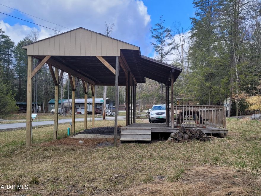 Large campsite with 38' long pavilion to protect your camper.  Also 14.5' x 20' partially covered deck.