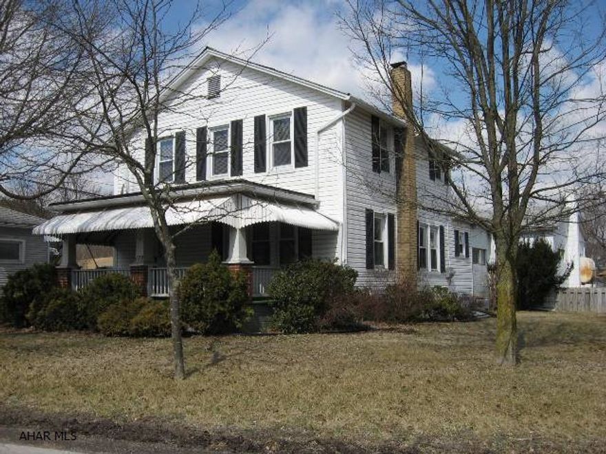 This home is ready to move in and has so many wonderful features:  Corner lot, just minutes to schools, mature landscaping, central air, 1st floor master bedroom and half bath, 3 additional bedrooms, 2-Car attached heated garage with a large storage/utility area off back, extra storage areas throughout, large front porch and more.  Plus - Additional Guest House/Office/Get-a-way space that has unlimited potential.  Don't wait to see this one!