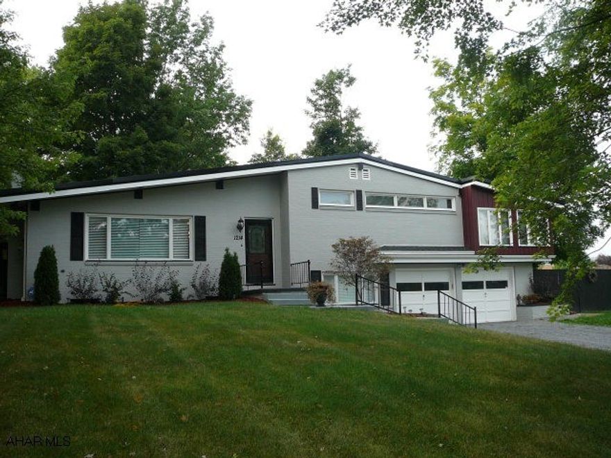 Redone throughout.  New plumbing and electrical systems.  New kitchen and baths, new lighting, new roof, fenced yard, security system, large lot.  Really a nice family home.