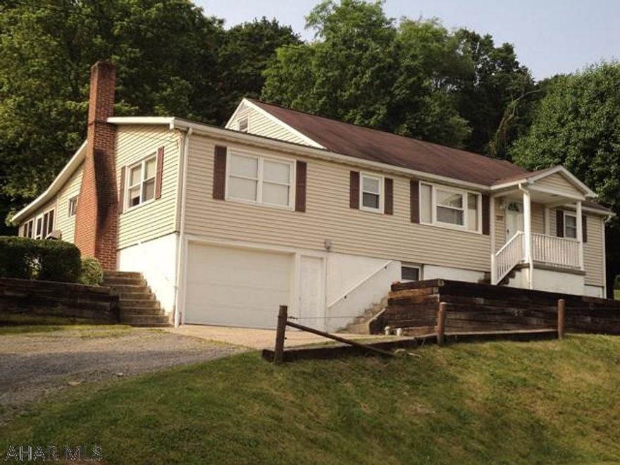 Just outside the borough and over looking Hollidaysburg in Blair TWP.  This well maintained 3 could be 4 bedroom house features hardwood & carpet floors,  a spacious enclosed carpeted patio, an integral 1 car garage and a 2 car detached garage with water and electric which was used as a workshop with loft above the garage area.  The large yard adds to the overall setting of this property. Property is in the process of being surveyed.