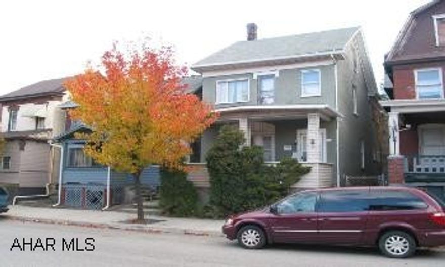 2 1/2 story brick, up & down rental units.