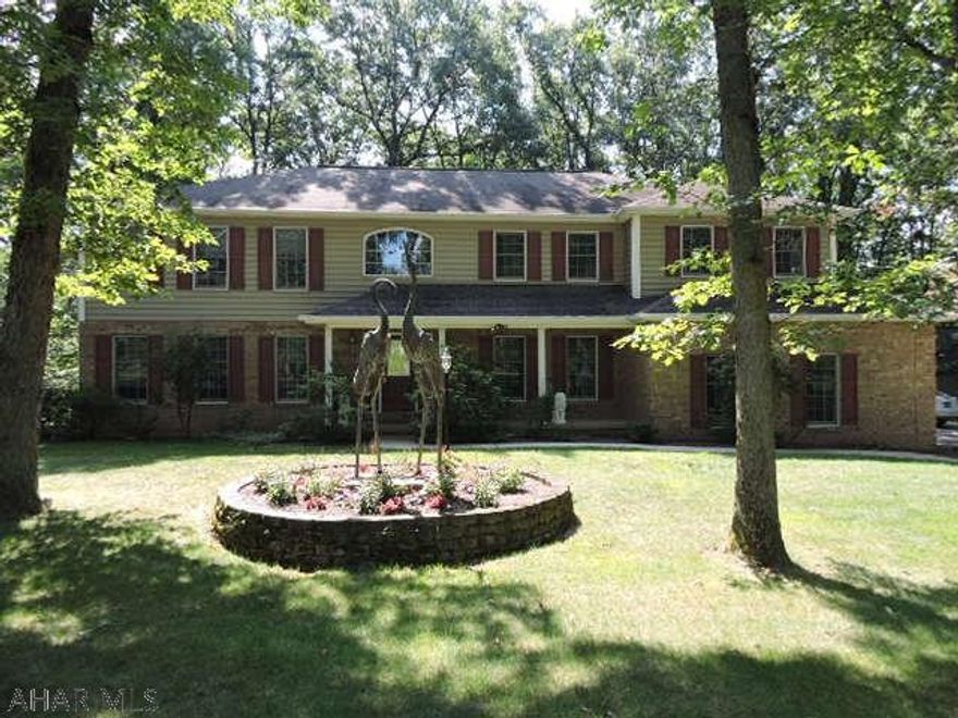 Motivated seller! Stately home in Regency Estates on park-like corner lot.  This well appointed home won't disappoint. Large rooms & plenty of baths.  Heated sun rm brings the outdoors in with big windows and many skylights.  Sale include .83 acre parcel with det 2-car garage. The det garage has loft area, electric, heat, phone, cable, skylights & large windows.  This would make a terrific artist studio or office.  House has oak trim, crown molding, & solid 6 panel doors throughout. Oak kitchen & baths enhance the livability. Ready to move into as it has been freshly painted inside & out. Have a green thumb? there is a 5x15 greenhouse attached to the home. In case of a power outage there is a natural gas whole house generator.