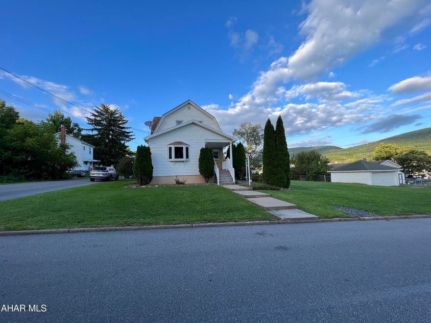 Welcome to this inviting two-story home found in the sought-after Pleasant Valley neighborhood of Altoona. This charming residence offers a perfect blend of comfort, modern amenities, and is conveniently located near schools, shopping, and parks.
The modern kitchen is a highlight of the home, offering ample cabinet space, sleek countertops, and updated appliances. Whether you're a seasoned chef or simply enjoy cooking, this kitchen provides the ideal space to prepare delicious meals for friends and family.  The first floor also includes a beautiful formal dining room with ceramic tile floors and large windows that flood the room with natural light. The living room is large and has recessed LED lights that have been strategically placed to illuminate every corner with balanced and energy-efficient lighting.
The well-maintained front yard highlights a variety of plants and flowers, framing the entrance with bursts of color. A concrete path leads to the backyard where you can roast marshmallows over the firepit or sit back, relax and watch your children play on your wooden playset.  A composite deck extends from the back of the house, offering a seamless transition from the interior to the exterior. The deck spans the entire width of the house. The two-car garage has an attached bonus room that is the perfect blend of practicality and versatility. It supplies a space not only for vehicle storage but also for pursuing hobbies, work, or leisure activities in a comfortable and well-designed environment. Don't miss out - book a showing today and take the first step towards calling this place your own.'