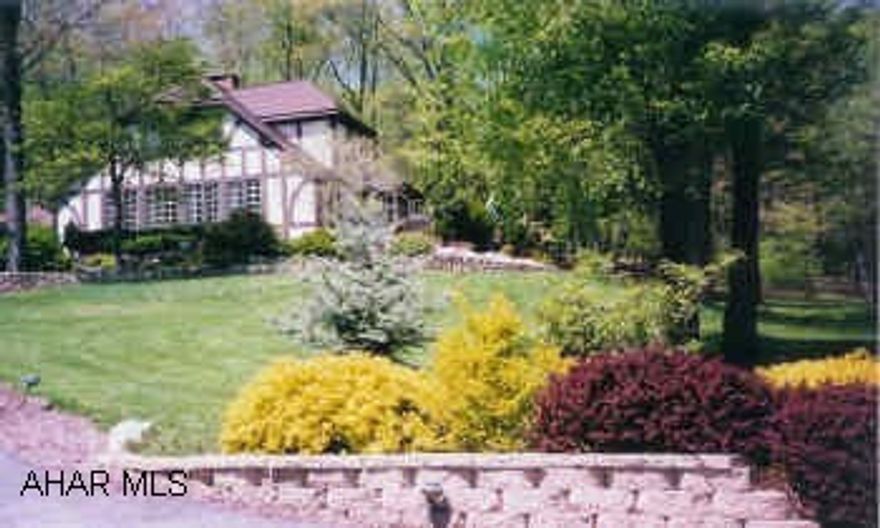 INCREDIBLE ENGLISH TUDOR WITH A SPECTACULAR UNOBSTRUCTED VIEW OF THE VALLEY.  CONTACT WALLY ROSSI AT 946-4343 X122. INCREDIBLE ENGLISH TUDOR WITH A SPECTACULAR UNOBSTRUCTED VIEW OF THE VALLEY.  APPROX. 3400 SQ.FT. OF LIVING SPACE, 3-4 BEDROOMS, 2.5 BATHS, CATHEDRAL CEILING IN LIVING ROOM WITH FIREPLACE AND SPIRAL STAIRCASE, FINISHED BASEMENT WITH WINE CELLAR.  BEAUTIFULLY LANDSCAPED 4 ACRES. LANDSCAPING HAS DIAMOND CONCRETE RETAINING WALLS, MULTI-LEVEL DECKING WITH HOT TUB, ON A VERY PRIVATE 4 ACRES WITH MATURED TREES AND FOLIAGE.