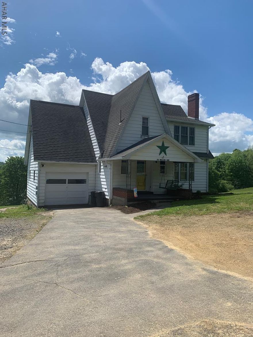 Fantastic 1.5 story home at the edge of town. Approx. 0.7 acre lot in lawn with a beautiful view. The home has 3 bedrooms, 1.5 baths, eat in kitchen, formal dining room and nice living room with brick fireplace.  Oil and coal heat. Great condition. Front and rear porch. Great house!