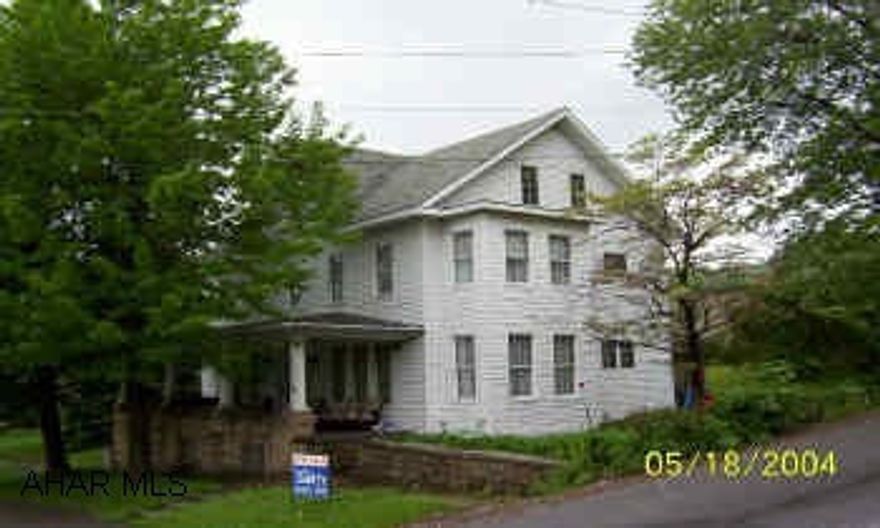 There is a 26' X 85' out building but it is " not included" in this sale. The lot size is approximated to be 105' X 123'.