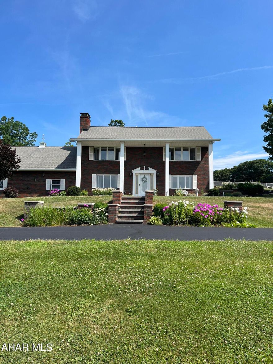 Beautiful 3BR brick home on 7 acres on private setting in Logan Township. Property offers inground pool, large 60x62 steel building (once a stable), 20x20 steel building, privacy and beautiful view. This is a jewel nestled close to everything. Measurements & taxes are approximate.
