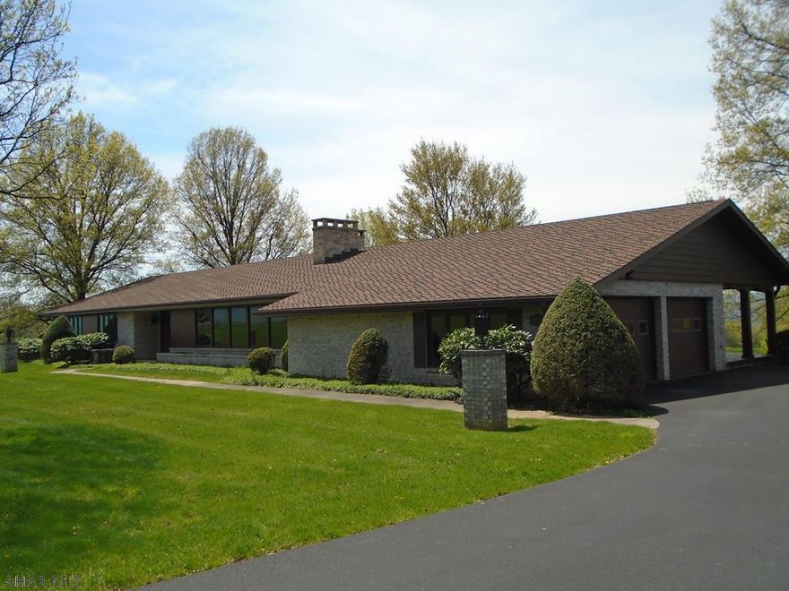 Brick ranch 4000+ sq ft home in Sylvan Heights Area. Double front door entry to the foyer. Enter the spacious living room with lots of natural light. The living room and dining room have a double sided wood fireplace.The great room is very spacious with access to the back covered patio with amazing views!!! The kitchen has daylight ceiling lights and recessed lighting. Eat-in Area. Sit and have a cup of coffee with a WONDERFUL VIEW. Mud room with laundry area. Half bath. Tons of closet space. Extra wide hallway to access the 3 BRs with hardwood floors. Plus very spacious master BR with double closet & hardwood floors. Master bath with double sinks. Basement entry with brick accent wood fireplace. Open basement with lots of room for entertaining. Bar w/ booths perfect for parties. Call me!