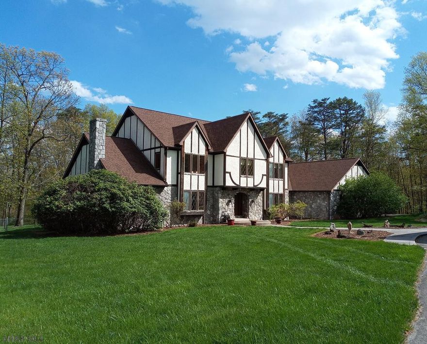 Sheltering in place would be no problem in this Raystown Retreat, conveniently located in Leffard's Bench off Piney Ridge.  The possibilities are endless with this unique property.  It boasts a 4-5 BR, 6 BA home with large spacious rooms and open floor concept. Enjoy entertaining in the large first floor rec room with wet bar, sauna, hot tub and 3/4 and 1/2 bath.  Cathedral ceilings, sky lights and custom windows abound to let in the outdoors. There is a large 48 x 96  pole barn to store all your toys. If you're looking to increase your living and outdoor space, this is the home for you.  You'll love working from home in the study with bay window, french doors to deck, insulated sound barrier. Minutes to Raystown Lake.  Call for inquiries.