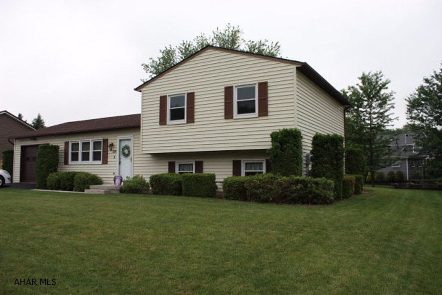 All updated and ready to move in and if the summer gets hot, you have central aircon. Nicely maintained home on 1/4 acre lot in Woodland Terrace.  Enjoy summer breezes on the covered patio.  Low maintenance exterior and newer roof.  Home features laminate wood floors and skylights.  Finished lower level.  All new windows with transferable warranty.  Front loading washer and dryer are included with this home.