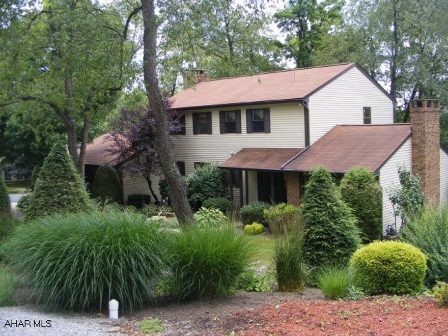 Absolutely wonderful home in Stonehedge! Terrific living room with vaulted ceiling and fireplace, formal dining room, very nice eat-in kitchen with cherry cabinets, corian and ceramic floors, looking to beautifully landscaped yard. Great family room with brick wood burning fireplace and built in bookcases, opening to large covered porch. Master bedroom has newly remodeled bath. Finished lower level with lots of storage. Gas hot water heat-3 zones.