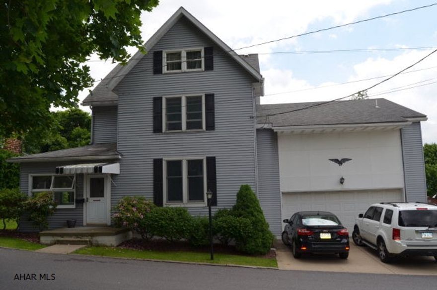 Beautiful home with tons of extras. Step down master suite with sitting room,walk in closet and fully refinished master bath. Kitchen has radiant heat floors. Built in shelving in den and living room. Heated garage and driveway. Two decks off the back with views. Hot tub is included. Fenced in yard.