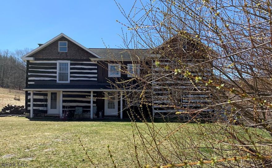 Escape the city and recreate life in these beautifully restored circa 1800 log homes in the magical surroundings of the Pennsylvania Alleghany Mountains.  Details and more details will heighten the senses once you enter this enchanting oasis where fishing, hunting and hiking are all part of the adventure.  Imagine life as a pioneer but wow modern conveniences like central air, spacious kitchens, 2 bathrooms, 2 car garage and so much more.  Enjoy relaxing by the crystal clear spring fed pond with views that will take your breath away.