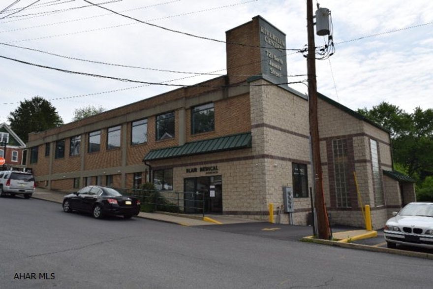 10,000 square foot professional office building setting on one of Hollidaysburgs main high traffic thoroughfares along with PenDot and the PA State Police. 2,800 square feet of modernized space currently available with built out options. ADA compliant. Parking lot with 37 spaces and additional off street parking. Lunch area overlooking the stream below. Lease space available. Call listing agent for more information.