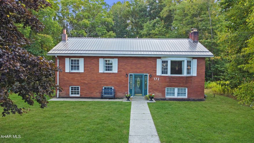 Welcome to 172 Harding Avenue, a stunning all-brick split-level residence tucked away on a serene dead-end street in the Central Cambria School Districts. This meticulously maintained home blends timeless elegance w/ modern updates, including a sleek metal roof, upgraded plumbing, newer flooring, & more. The main level offers a bright & spacious living room, formal dining area, & an inviting eat-in kitchen w/ a breakfast bar, complemented by an updated full bath & three generously sized bedrooms. The walkout basement expands your living space w/ a large family room featuring a cozy wood-burning fireplace, a second full bath, a versatile bonus room ideal as a fourth bedroom or home office, & a convenient laundry area. Outdoors, enjoy the privacy of a peaceful lot with off-street parking, a lush yard, & a storage shed. Call today!
