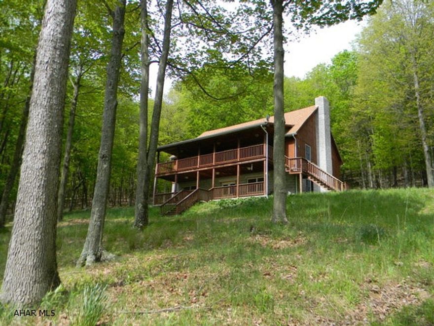 Custom Built Home With Fantastic Views. Main level offers a great room w/cathedral ceiling & wood stove, kit w/breakfast bar, D.R., Master Bed & Master Bath. 2nd level has a Den, Bed & 1/2 Bath. Full finished Bsmt w/Rec room w/wet bar & wood stove, 2 Beds, 1/2 Bath & Laundry room. Over 4,000 SF of living area. 26.7 acres and just seconds from State Game Lands & White Sulphur Springs. Large pole barn & garage.