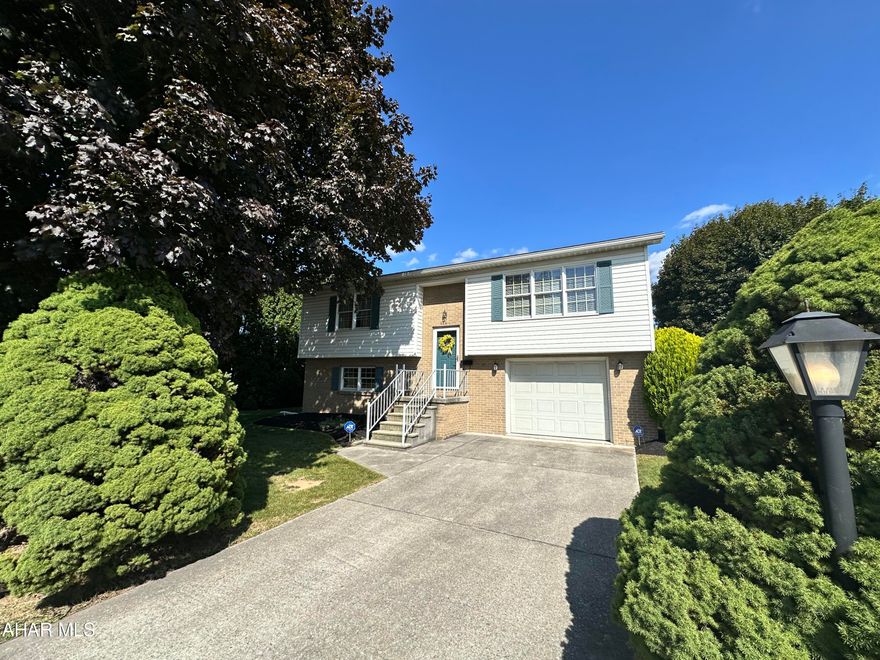 Roaring Spring Borough is where you will find this raised ranch home. The interior offers 2 bedrooms with main floor living, and a nice sized living room with triple window and plush carpet. You will also find a formal dining room, a kitchen with stainless appliances and an eat in area. The lower level has a family room with carpet, bonus room that could be an office or a playroom plus laundry room with 3/4 bath. To the rear of this property there is a covered patio and a large shed.  The one car integral garage will protect your vehicle. Central AC is a great way to stay cool. The exterior is vinyl with brick accent.