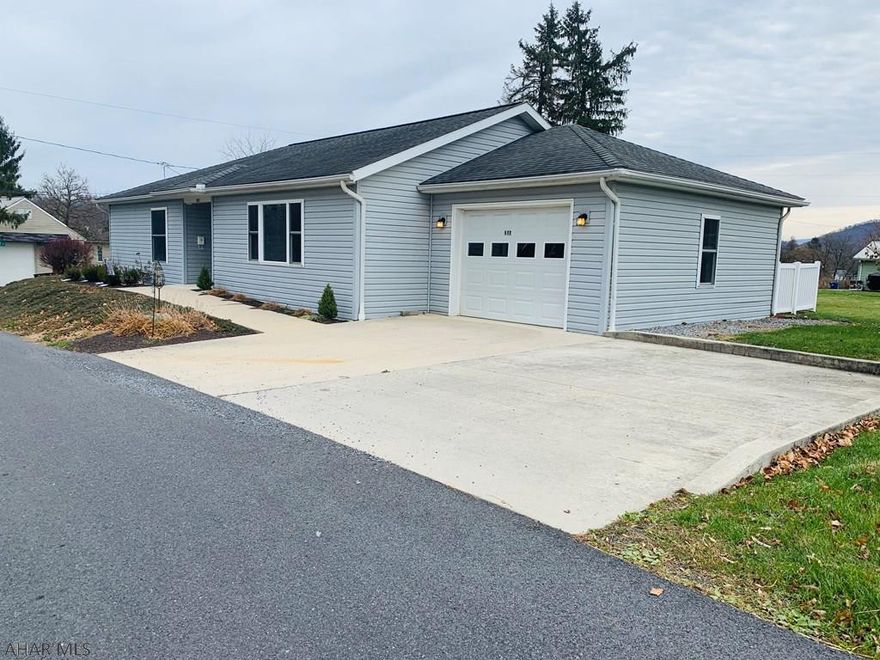 Wow...this house has too many great features to list at an unbelievable price.  Located on a quiet street within walking distance of historic downtown Bedford.  Gorgeous open concept design includes cathedral ceilings, recessed lighting, quartz countertops, energy efficient natural gas heat, tankless water heater, wheelchair accessible shower and fenced yard.  Imagine the convenience of a main floor laundry room and each bedroom having their own bathroom while enjoying a designer inspired kitchen which has an amazing sit up bar.  The pet friendly fenced yard and attached garage makes this home a must see that will not last long.