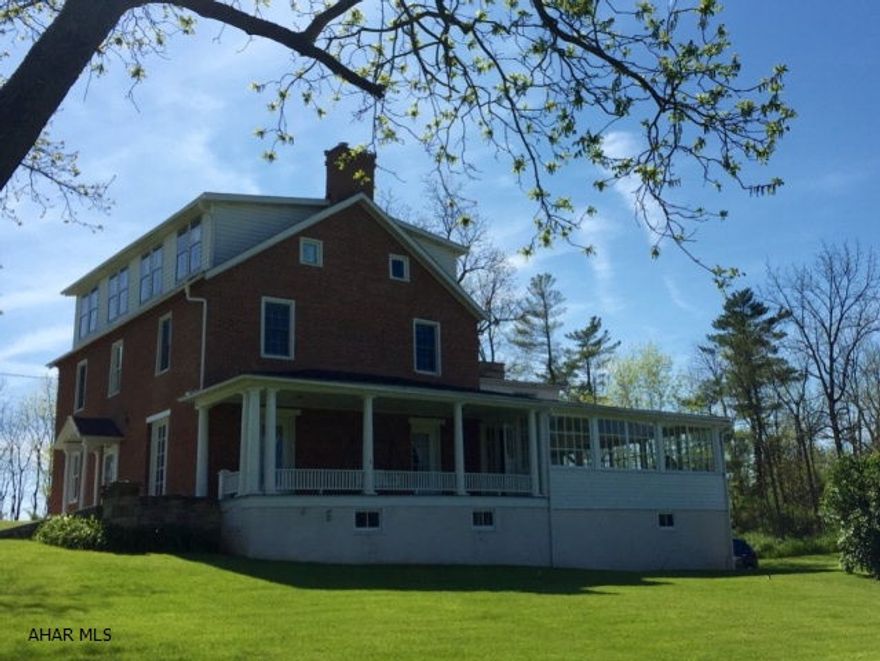 Restored circa 1815 historical home in historic Bedford County on 1.7 acres surrounded by lush landscaping. The home has been exquisitely restored and small details make this home simply stunning. The owner's suite is huge and offers private bathroom, sitting room and kitchen. 3 additional bedrooms share another full bath. The 3rd floor could offer an additional 900+additional living space. The first floor has a large eat in kitchen, formal living and dining rooms,sun room and office or bedroom. The deep recessed Windows, fireplaces, custom woodwork,covered porches, stone and brick exterior and stately columns add tremendous character.