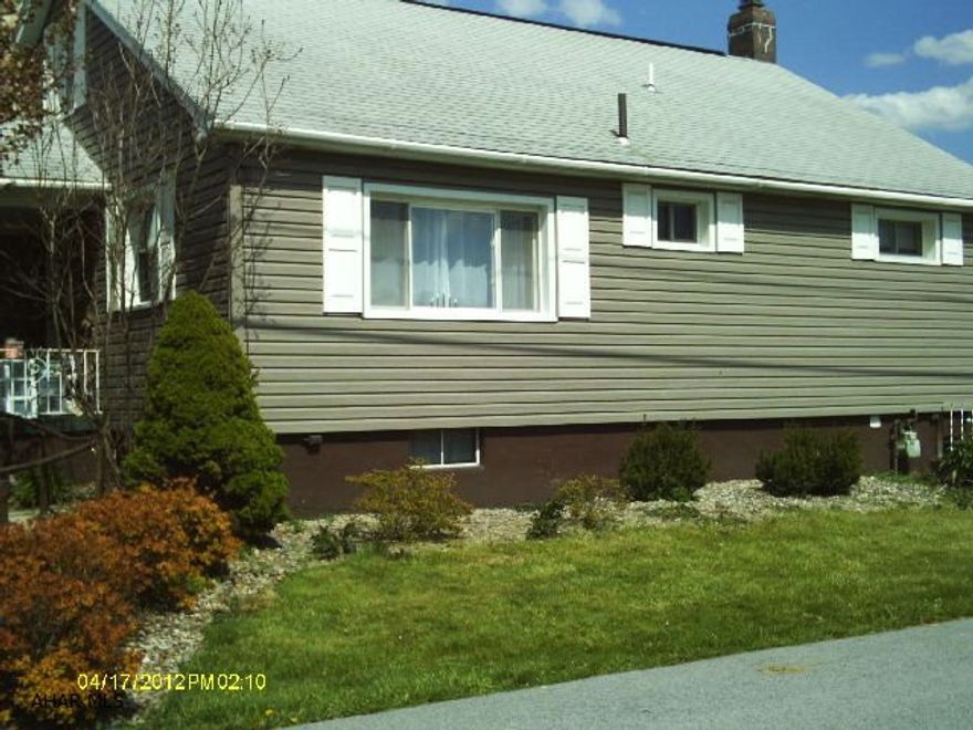 1 1/2 story vinyl, 3 bedroom, 2 1/2 bath, hardwood floors throughout, central air, finished basement, basement was previously used as a studio apartment. 2 seperate garages.