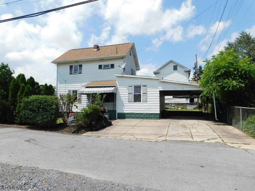 Clean 2 bedroom house in Hollidaysburg!  This home features a large spacious kitchen with open flow throughout the first floor.  You can also enjoy a private back yard and off street parking and covered carport!  Contact the listing agent today for your private tour.  Access property from alley off Clark Street.   walk up Attic could be finished as a bonus room