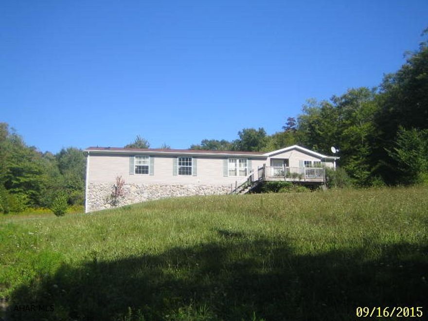 Double wide on permanent foundation on 2 acre lot. Living room with fireplace and vaulted ceiling, eat-in oak kitchen, master bedroom w/ full bath, 2 car integral garage. Needs TLC throughout.