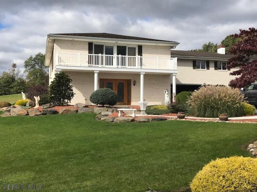 Outstanding 3-4 BR, 4 BA home in Logan Twsp!! Too many amenities to list. Tile flrs, 2 family rms, huge MBR featuring sitting rm with spiral staircase & 2 person jet tub & sauna, heated floors, as well as storage for everything. Open living space that includes the kitchen, DR, laundry, 2 central vacs, heated and cooled sunroom, qoi pond and room for 4 vehicles.  Natural gas backup generator kicks on automatically during any power failure to keep heat and strategic power operating until electricity resumes.  Made to entertain family & friends. Call for showing of this fantastic property.