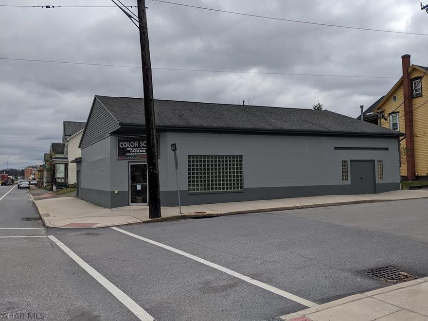 Roughly 3000 square foot cement block 1 story building in a high traffic location. 4 total parcels include large building in Industrial zoning along with adjacent lot and a separate parking lot on the next block. Addresses include 2000-02 7th Ave 2004 7th Ave, 1922 7th Ave and 1924 7th Ave. Square footage is approximate.