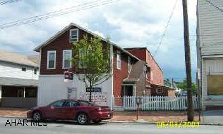 Store & 2 apartments on 2nd fl. Store frontage along Magee Avenue.