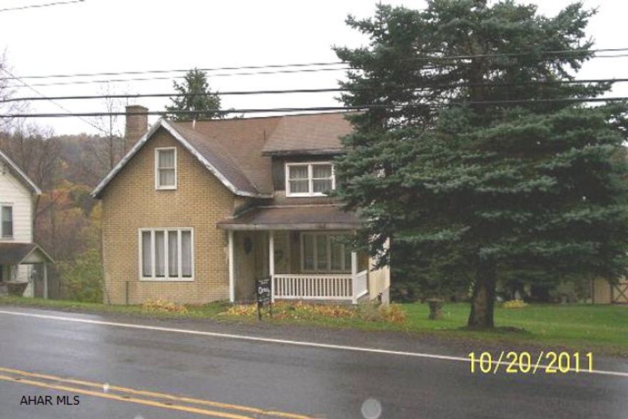 2 BR Cape Cod with large 2 car garage on 109 x 183 lot. Public water & sewage