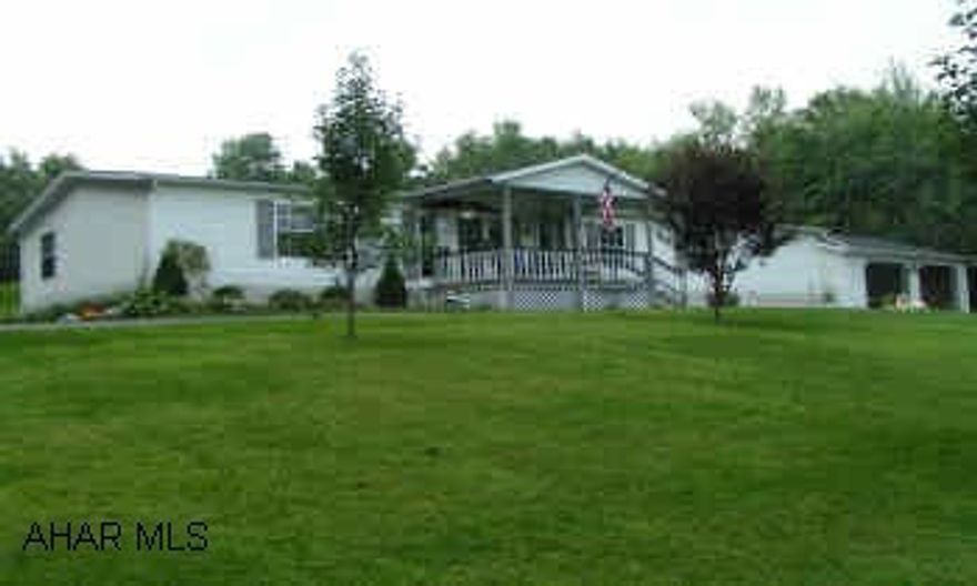 Very nice 1999 Skyline double wide 3 BR, 2 bath, FR with gas fireplace & built in entertainment center, kitchen with oak cabs & island bar, dining area built in China cab, sky lights kitchen & baths, dry walled, 2 car garage macadam driveway, central air. Very nice 1999 Skyline 70x28 double wide 3 BR, 2 baths, FR with gas fireplace & built in entertainment center, kitchen with oak cabinets & island bar, dining area with built in china cab, sky lights in kitchen & baths, garden tub, dry walled walls, central air, 2 car garage with U shaped macadam driveway,  all on one country acre.  Calll Bonnie 814-942-2172