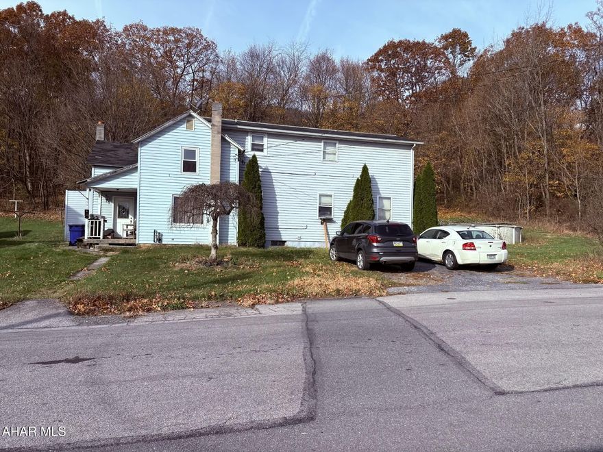 Calling all investors!! Large house and large lot with a lot of potential. The roof over the kitchen area ONLY is leaking and needs to be replaced .The house needs TLC .It's close to town, within walking distance to all the stores, restaurants and downtown attractions. The Large family rooms make it a great family home . Parcel G9 B4 141 located in the rear of the property has 1.26 acre available for potential. The House is Sold AS-IS!!