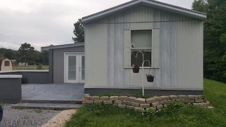 Beautifully maintained, 1995 single wide Champion Mobile Home featuring 2 Bedrooms, 1 bath and a great room. This gem sits on flat, rented land and sports a large concrete patio, gravel driveway and shed. Lot rent is currently $235.00 a month. It is located on Mill Rd and is not in a mobile home park.