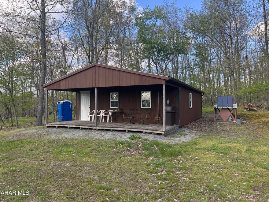 Primitive hunting camp on 18.4 wooded acres. One story frame camp with 2 bedrooms and kitchen, living area combo. Private lane access (approx 100yds+) in length. Camp has no well, septic (porta john) and elect is from a generator. Great getaway not far from the city to go back in time! Good hunting area.
