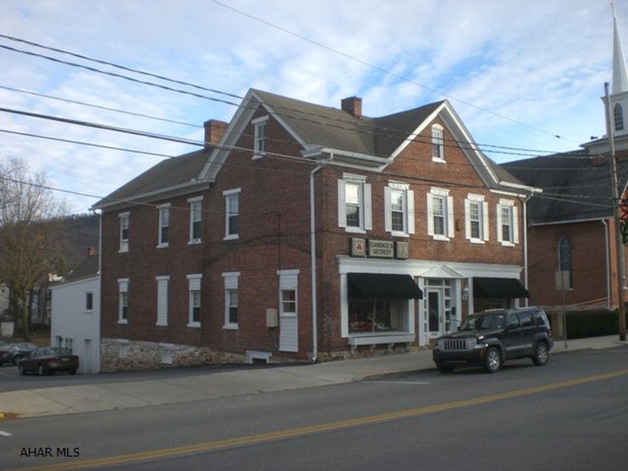 Very well maintained two-story brick office building in downtown Bedford. Super location, large off-street parking lot, excellent visibility and exposure and long term tenants. Building has three (3) first floor office tenants, one large second level apartment with tenant and office space in the basement for a tenant. Basement office space is walk-out level and easily accessible. Many updates on the building including electric with new meters, replacement windows, interior/exterior paints and floor coverings. Natural gas hot water furnace with three (3) separate zones, natural gas forced air furnace with central air and electric baseboard heat.