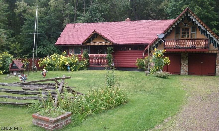 Quality craftsmanship adorns this rustic home inside and out situated on 1+acre lot! This hand built custom home features charming landscapes and breathtaking views of rural cambria county.  Handcrafted woodwork and glass work accentuates this home beautifully from the oak walls to the stained glass windows. Property features 2 plus bedrooms and a possible 3rd with the loft. Bathroom has recently been updated. The back deck is the perfect place to unwind and enjoy the changing of the seasons and all that nature has to offer. Large 2 car garage with plenty of additional space for a workshop or even finishing the upstairs could be great for a guest suite.. Property is priced to sell call today to make arrangements to see this magnificent and one of a kind home!