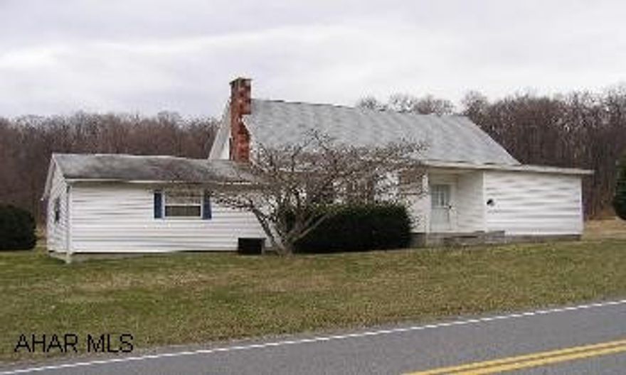 Handsome 1.5 story vinyl, 3BR/1BA house on 3+acres of open, level land, fenced for animals. Garage/barn/shop outbuilding Central air, thermal windows, newer oil FA furnace, 200 amp service, large rear porch, quiet location.