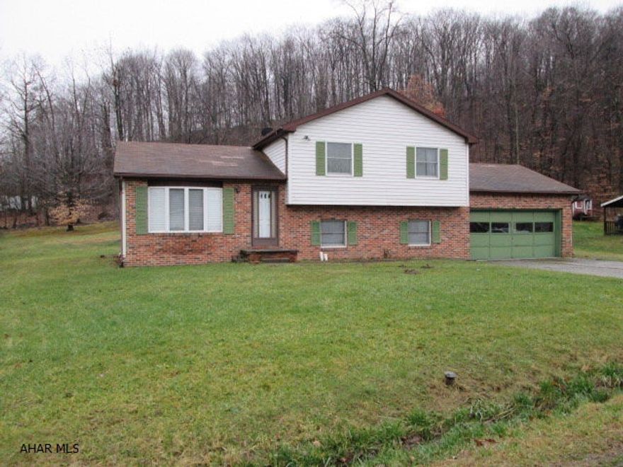 Terrific house at a great price!  Home has a wonderful eat-in kitchen with plenty of cabinet space.  Master bedroom features a master bath.  Super family room with a cozy wood burner.  Gigantic 2 car garage.  Peaceful and private backyard.  Home sits on a 99X150 lot.  Close to shopping and entertainment!