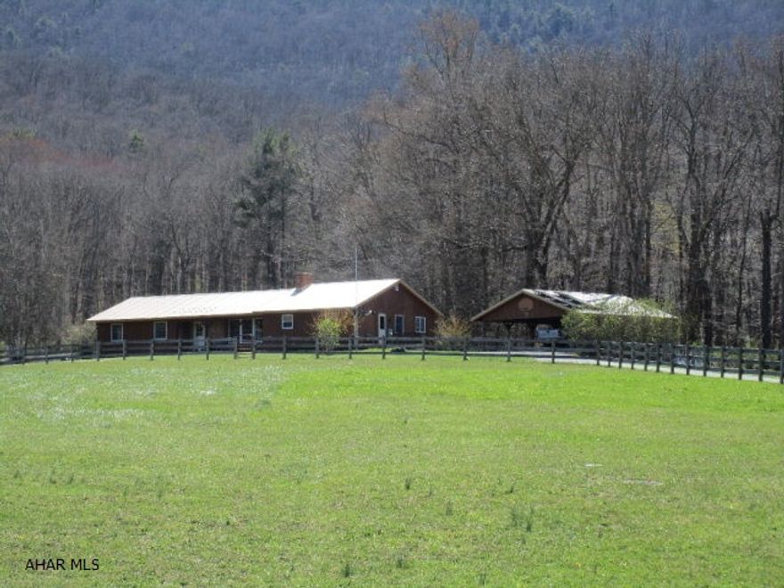 244 acres of land adjoins State Game Lands & only 9 miles to the PA/MD State Line. Bank Barn w/4 stalls, hay barn & equipment storage bldgs. Year round stream in pastures for livestock. Great pond for fishing. Approximately 50 tillable acres. Horse, cattle, livestock or hunting; you name it this place most likely has it. 10 Point Deer was taken in the upper pasture, huge wild turkeys & at the top of the ridge are State Game Lands. The home has a lodge like atmosphere tucked back against the trees with breathtaking views in all directions of the mountains. Sit on your front porch & you have mountain views. Three bedrooms, a sun room, family room & living room with plenty of space for everyone.  This property has unlimited potential. A completed survey. Country living, peaceful & quiet!!