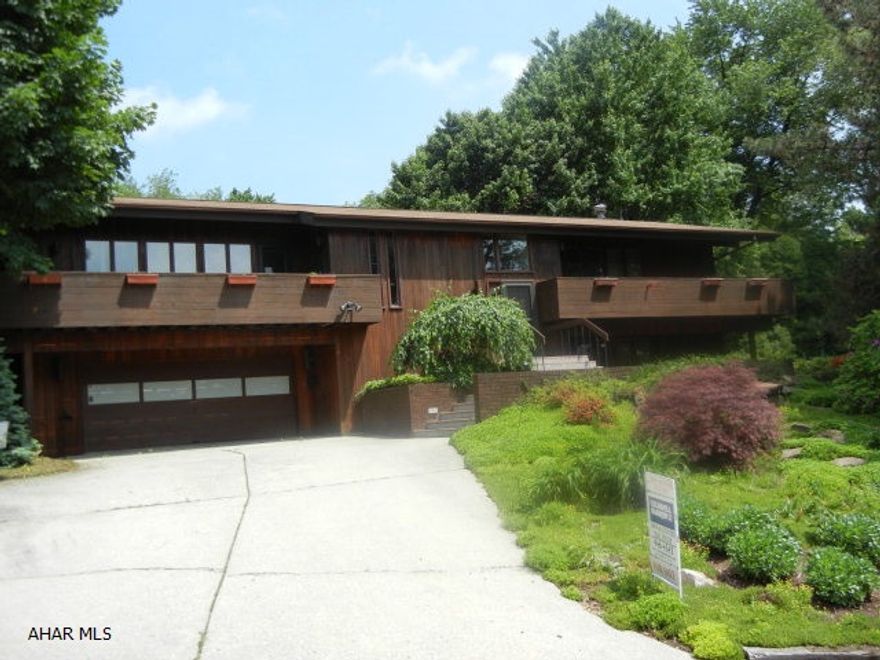 Cedar sided home in private location. Unique floor plan ideal for entertaining, upper level living in quality constructed home. Lower level suitable for home office. Heated in-ground pool offers privacy & comfort. Newcomers to Altoona will find this a spectacular well-located home with 2 car integrated garage & many extras. Convenient central location.