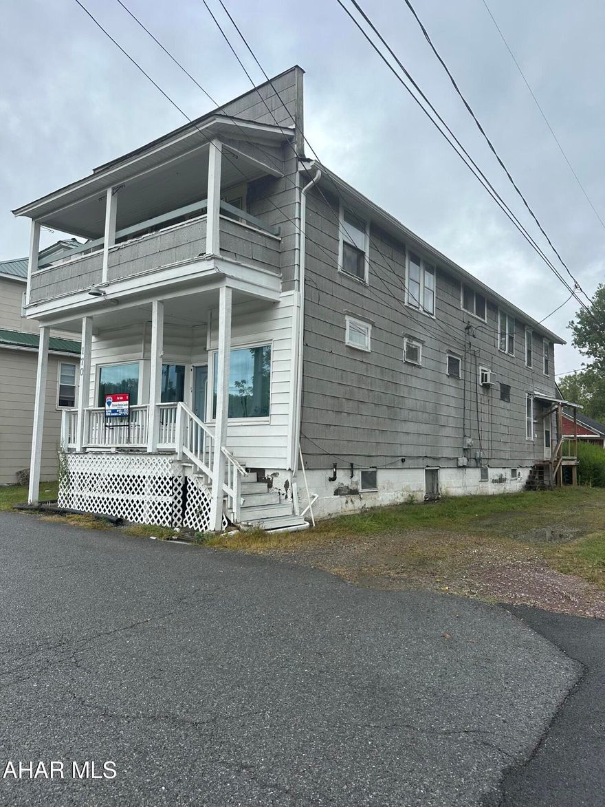 Comparable sale. 2-unit building with detached garage. First floor apartment includes open living room/bedroom, eat-in kitchen w/ laundry hook ups, updated bath with walk in shower, pantry and basement access. Second floor apartment includes living room, kitchen, dining room, 2 bedrooms, full bath, laundry room and a balcony.