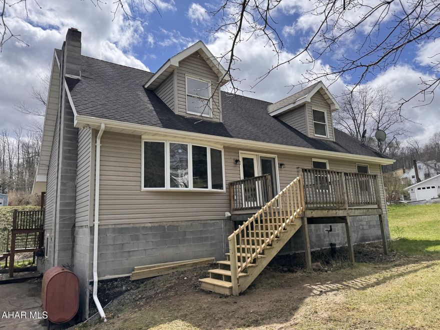 Penn Cambria Schools:  4 BR, 1 1/2 BA vinyl cape cod on approx. 1/2 acre lot.  Open floor plan with vaulted LR ceiling, eat-in kitchen w/bar area. Oil, hot water heat with many zones.  32' x 36' detached garage.  Basement could be finished for additional living space.  appliances included.   Large rear deck for entertaining!