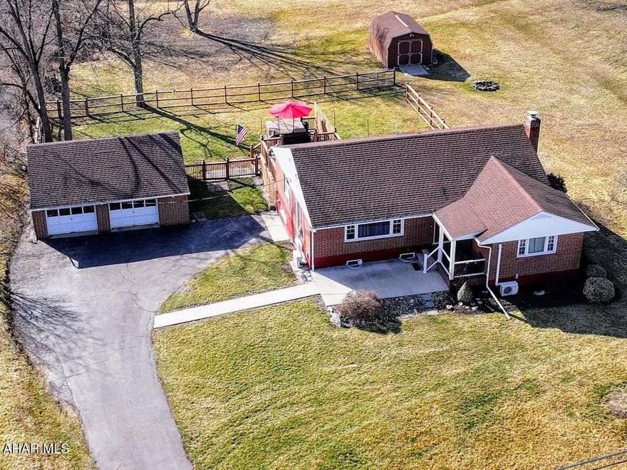 Great price on this brick charmer with beautiful wood floors that greet you as you enter the spacious living room and continue to flow into the adjoining dining area. The well appointed kitchen has an easy care tile floor and lots of room and storage for all your meal prepping. Just off the kitchen is access to a multi-tiered deck for outdoor entertaining or just relaxing in the fresh air overlooking the convenient fenced rear yard. The tastefully updated full bath and additional three bedrooms with wood floors give you lots of options for sleep or office space. Enjoy extra living area in the full  basement with a recently updated family room floor, large utility areas, laundry and access to the rear fenced yard. The blacktop driveway, detached two-car garage that houses an external dual fuel generator for back up power with full transfer switch in the home are just a few more reasons this home is right for you. Call to schedule your tour.