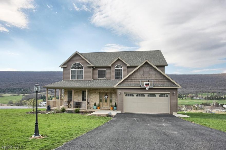 You won't find a better view from another home in Blair County.  This stunning two story home features ALL the upgraded features and then some!  Hardwood floors, ceramic tile floors, granite kitchen with large island and pendant lighting,  granite vanity tops in bathrooms, and central vac. Kitchen breakfast room has doors to deck.  Huge master bedroom has two large walk-in closets and an absolutely gorgeous master bath.  The three additional bedrooms on the second level are all spacious and have great closet space.  The lower level features lovely guest quarters with nice bedroom, 3/4 bath,  office, and second family room.  Doors on this level open to new paver patio.  This is quality construction at it's finest.   But that view tho!   Seriously!