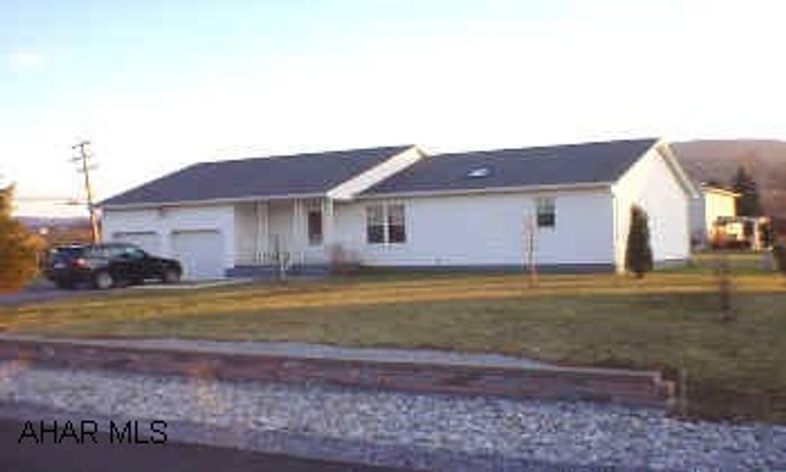 Carpet was professionally cleaned, please remove shoes or stay on runners.  3 bedroom, 2 bath ranch on corner lot. Features vaulted ceilings, skylights, open floor plan, white kitchen with ceramic tile counter tops, central air, 2 car garage, and enclosed rear porch.