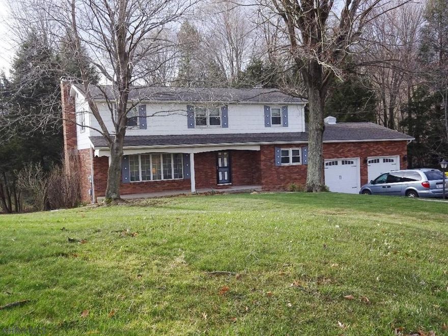 Spacious rooms through out! Hardwood floors, 2 fireplaces, four bedrooms, quality construction. Located on a quiet street. 3 parcels of land - 1.2 acres. A must see!