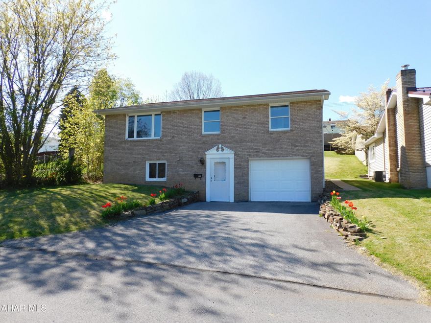 Tastefully updated home in the Pleasant Valley Area of Altoona! Immaculate Kitchen that features new cabinets, new countertops, and a tile backsplash. Spacious living room and remodeled bath on main level. 3 bedrooms all with new carpet. Beautiful hardwood floors in  the dinning room, living room, and kitchen. Family room in the lower level is great for entertaining. Fresh paint throughout the entire home. Integral garage and off-street parking. Enjoy the summer evenings while relaxing in the sunroom.